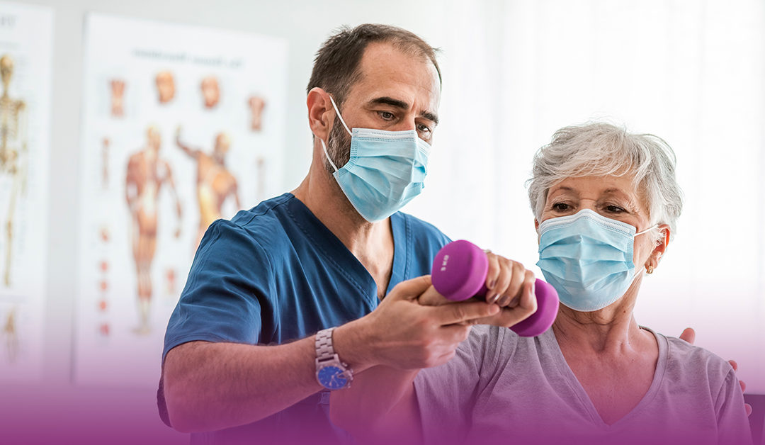 physical therapist assists elderly female outpatient rehab